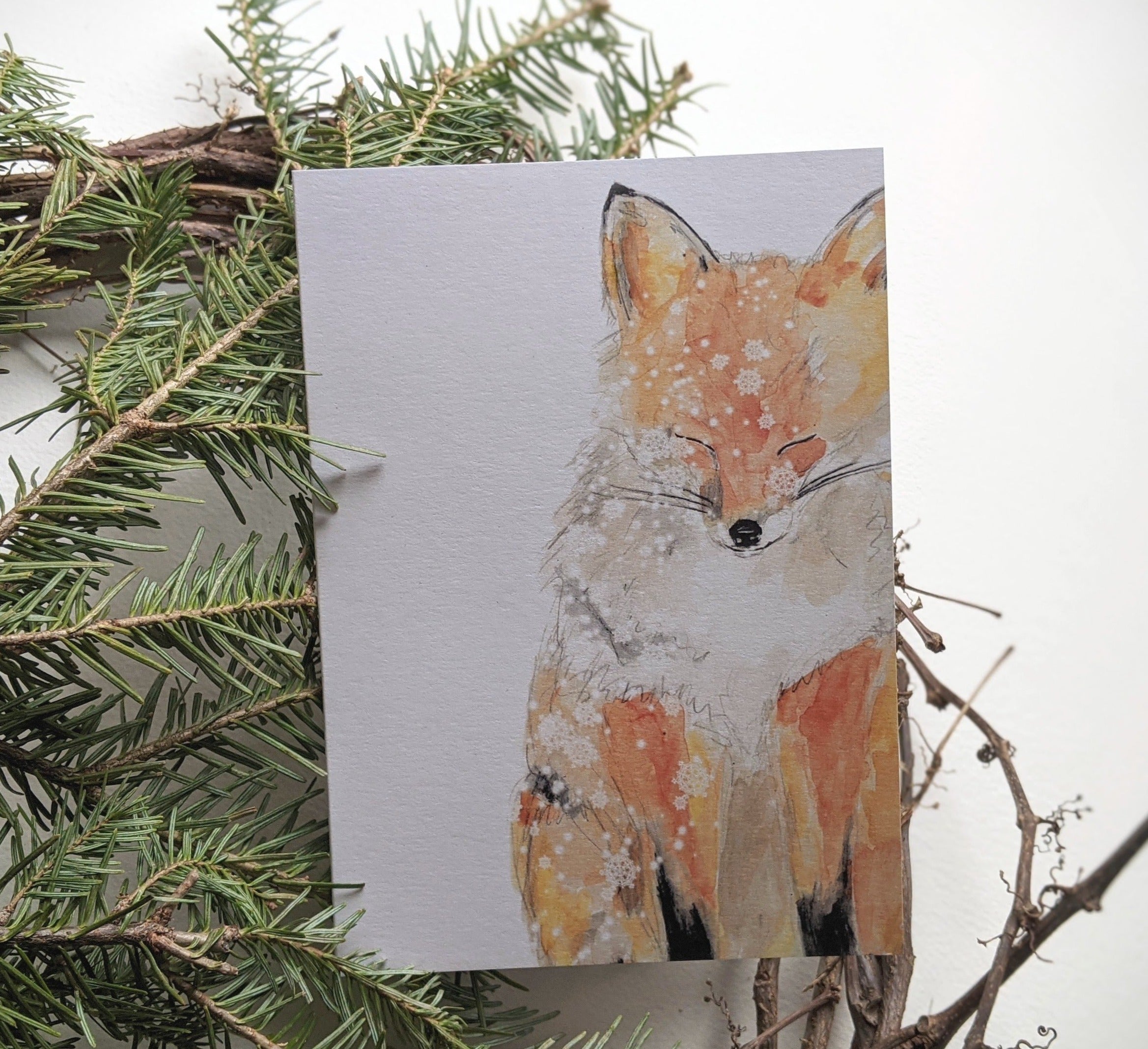 red fox enjoying snow fall
